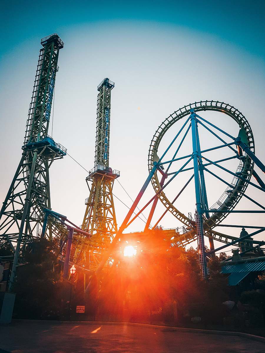 six flags new england roller coaster ride with sun rays agawam